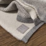 Tuwi Inti Knitted Baby Blanket in Soft Grey and Cream - Image 2